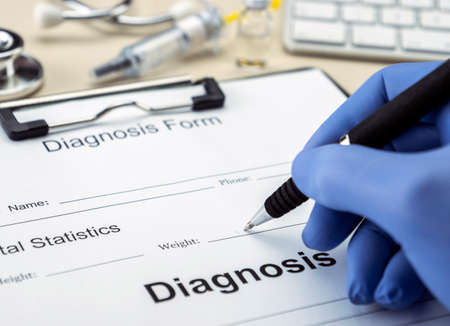 Doctor writing prescription in a hospital, conceptual imageの写真素材