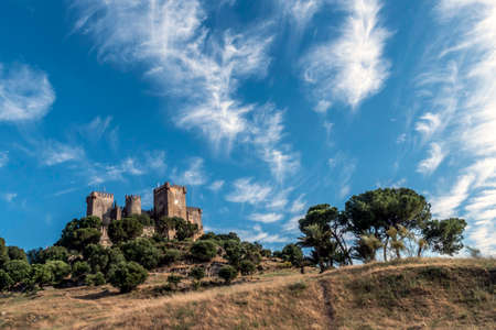 Almodovar del Rio, Cordoba, Spain - June 9, 2018: It is a fortitude of Moslem origin, it was a Roman fort and the current building has definitely origin Berber, of the year 760, Between the year 1901 and 1936 was restored by its owner, Rafael Desmaissiereのeditorial素材