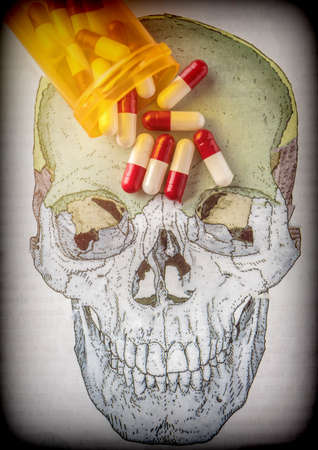 Capsules on a skull, conceptual image of life and deathの写真素材