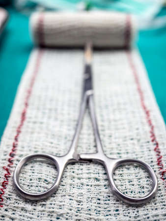 Surgical scissors on a bandage, conceptual imageの写真素材