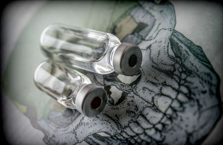 Vials on a skull, conceptual imageの写真素材