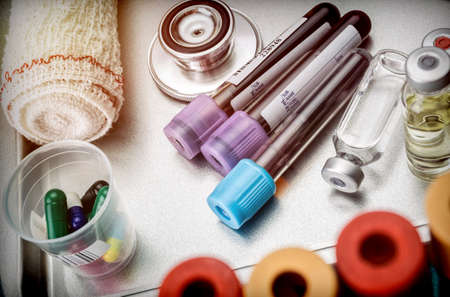 Vials and blood samples in a hospital tray, conceptual imageの写真素材
