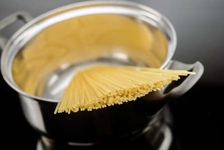 Spaghetti inside a pot, conceptual imageの写真素材