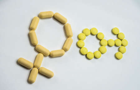 Symbol male and female formed with pills yellowの写真素材