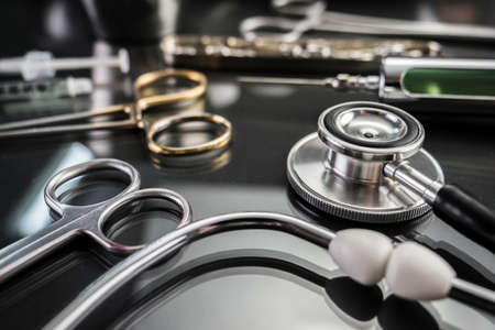 Some scissors for surgery on a tray in an operating theater, conceptual imageの写真素材
