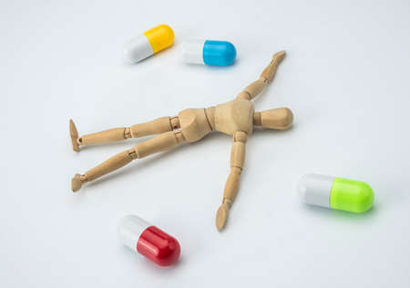 Doll articulated died of an overdose of pills, conceptual imageの写真素材