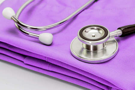 Stethoscope on clothes of nurse, conceptual imageの写真素材