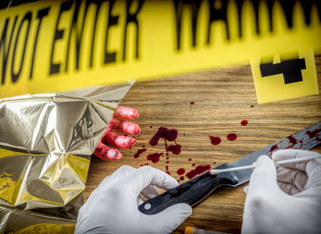 Crime scene for cutting weapon, Judicial police takes blood samples in scene of murder, conceptual image, conceptual imageの写真素材