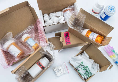 unpacking medication in boxes, Diverse medicines in boxes for humanitarian aid, conceptual image