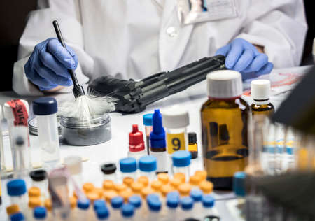 Expert Police takes samples in scientific laboratory, conceptual imageの写真素材