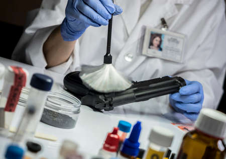 Expert Police takes samples in scientific laboratory, conceptual imageの写真素材