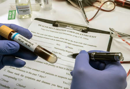 Scientist examines sample of coronavirus in laboratory, conceptual imageの写真素材
