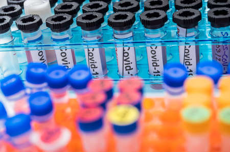 Vials with samples of SARS-COV-2 Covid-19 in a research laboratory, conceptual imageの写真素材