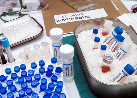 Vials with samples of SARS-COV-2 Covid-19 prepared cold in a hospital, conceptual image