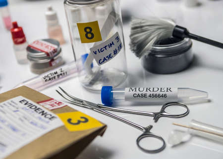 Hematological analysis with forensic test kit in a murder in a crime lab, conceptual image