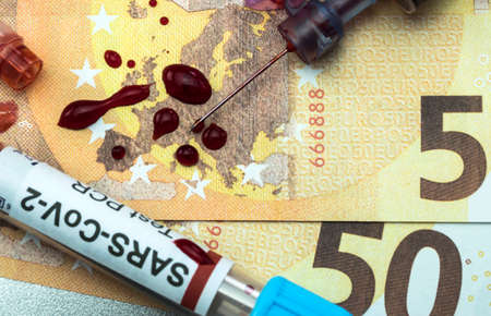 blood syringe with covid-19 vaccine on euro banknotes, conceptual idea