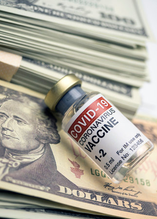 Covid-19 coronavirus vaccine for vaccination plan together with banknotes, conceptual imageの写真素材
