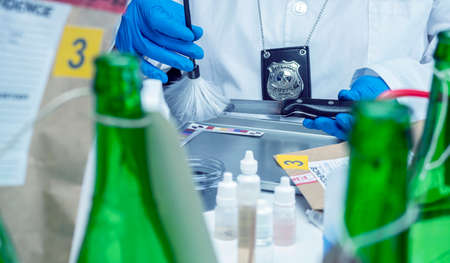 Police investigation of fingerprint on a knife, concept imageの写真素材