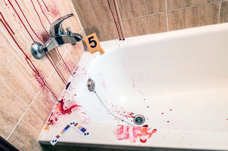 scene of a crime in a bathroom with tracks of blood, conceptual imageの写真素材