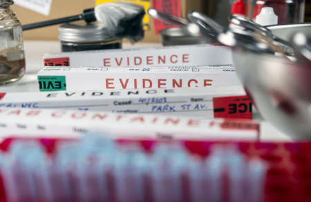 Files and evidence bag in a crime lab, conceptual imageの写真素材