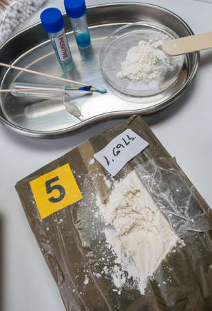 Police investigate positive for drugs in crime lab, conceptual image