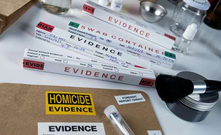 Files and evidence bag in a crime lab, conceptual imageの写真素材