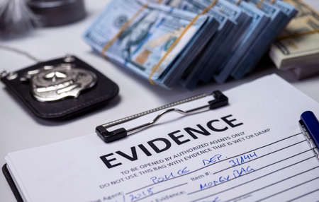 dollar bills in criminal investigation unit, conceptual image