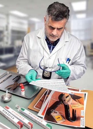 Police scientist checks chromatography analysis for traces of DNA on knife in crime lab, conceptual imageの写真素材