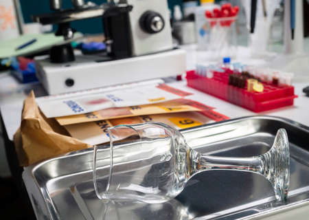 broken glass bottle in Criminalistic Lab, conceptual imageの写真素材