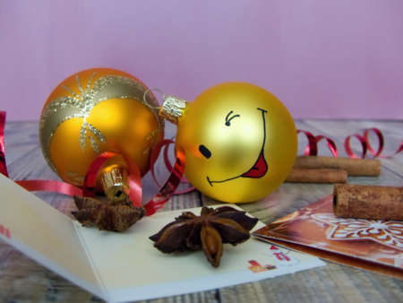 yellow christmas balls and red bowsの写真素材