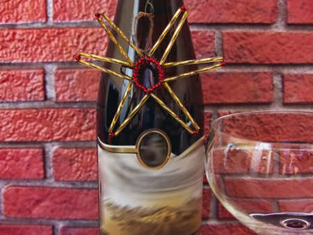 a bottle of wine and a glass ready to celebrateの写真素材