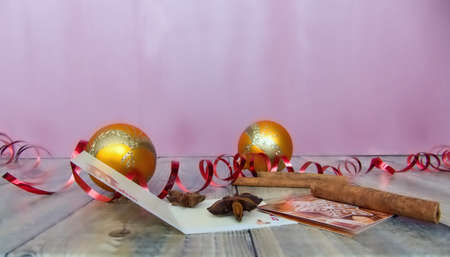 yellow Christmas decorations on old boards with purple backgroundの写真素材