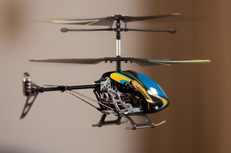 Flying RC helicopter indoorsの写真素材