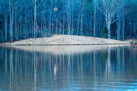 moon reflecting in lakeの写真素材