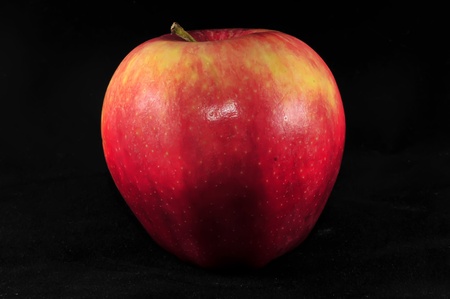 fresh red apple on black backgroundの写真素材