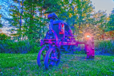 abandoned rusty vehicle on the farm lawnの写真素材