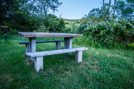 picnic table and grill at dusk in the mountainsの写真素材
