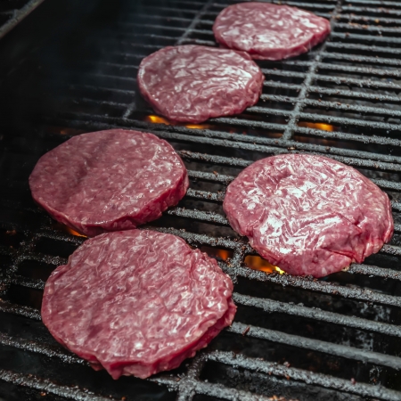 Photograph of   tasty beef burgers on the grillの写真素材