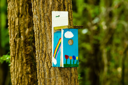 bird house with a rainbow colors