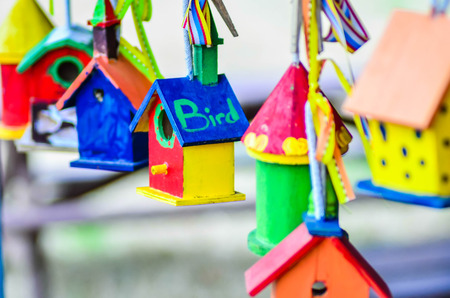 little colorful bird houses on clothes lineの写真素材