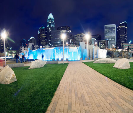 view of charlotte skyline at night near romare bearden parkの写真素材