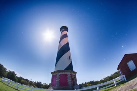 Diagonal black and white stripes mark the Cape Hatteras lighthouse at its new location near the town of Buxton on the Outer Banks of North Carolinaの写真素材
