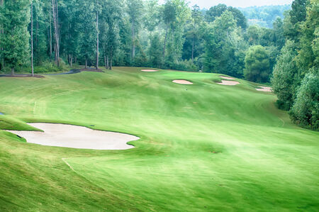 luxurious golf course on a cloudy dayの写真素材