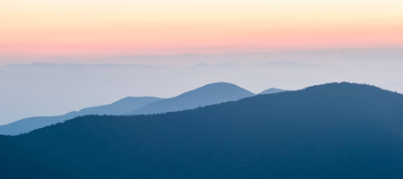 Nice sunset over mountainsの写真素材