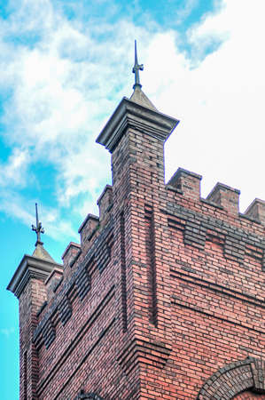 old brick church with blue sky and cloudsの写真素材