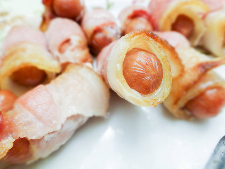 hot dog weiners in a bacon blanketの写真素材