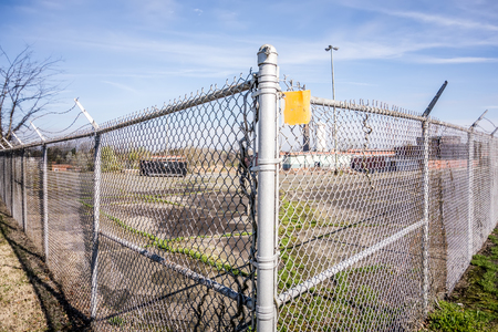 chainlink fence securing perimeter of propertyの写真素材