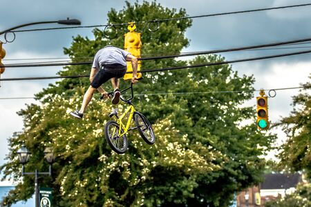 bmx extreme team making stunt in downtown york south carolina at summerfest 2015