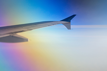 looking out of airplane window during flightの写真素材