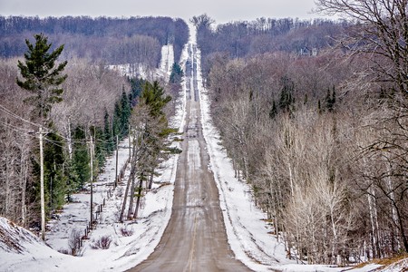 roadside trees and farms in michigan during winterのeditorial素材